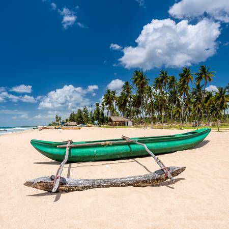 Boat on the beach in Trincomalee - Sri Lanka Tours - On The Go Tours