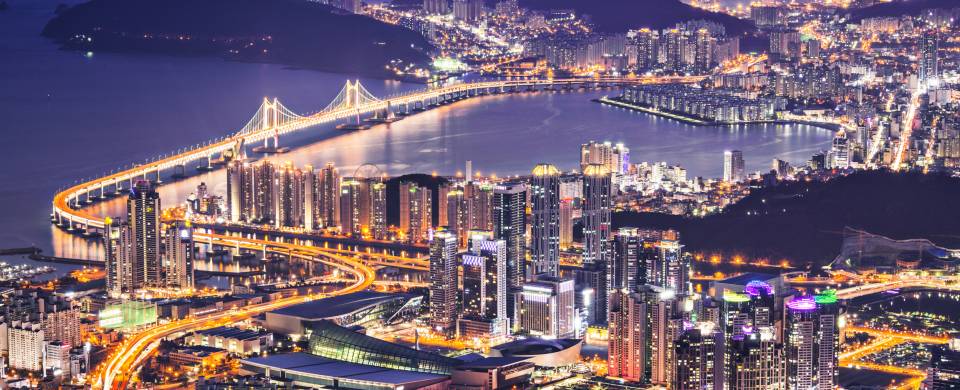 Aerial view of the cityscape in Busan, lit up at night