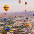 Hot air balloons floating over the stunning landscape of Cappadocia