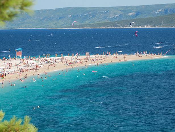 View of the main strip of Split, lined with palm trees along the waterfront