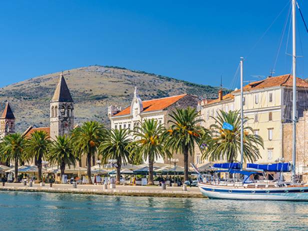 View of the main strip of Split, lined with palm trees along the waterfront