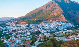 Chefchaouen Cityscape Rif Mountains backdrop 