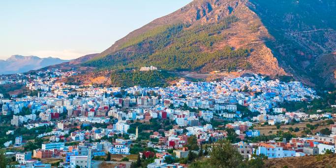 Chefchaouen Cityscape Rif Mountains backdrop 