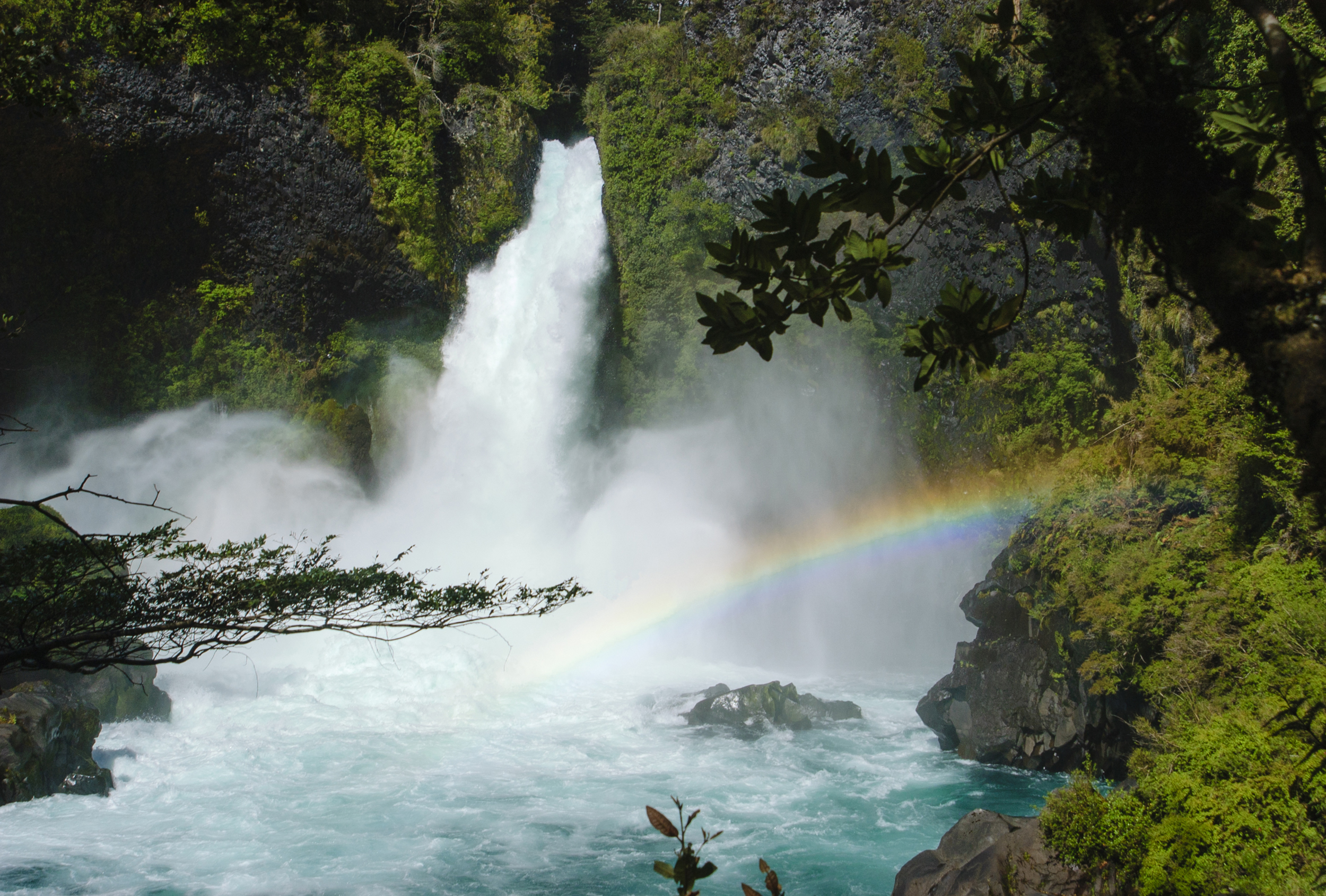 A waterfall with a rainbow in Hulio Hulio Chile