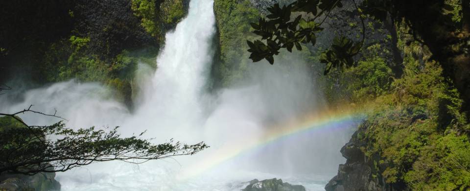 Tumbling waterfall and rainbow in Huilo Huilo