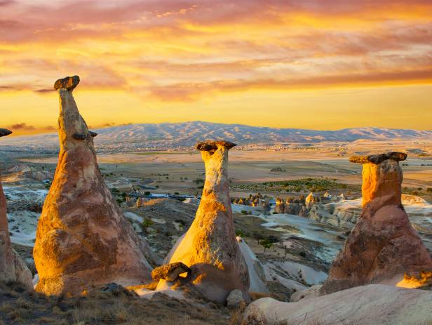 Hot air balloons floating over the stunning landscape of Cappadocia