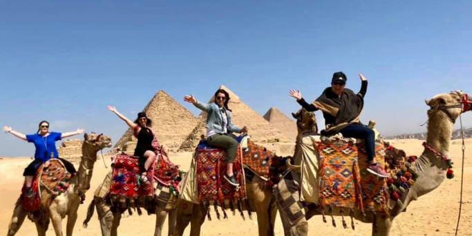 Ladies on camels at the Pyramids of Giza | Egypt | On The Go Tours