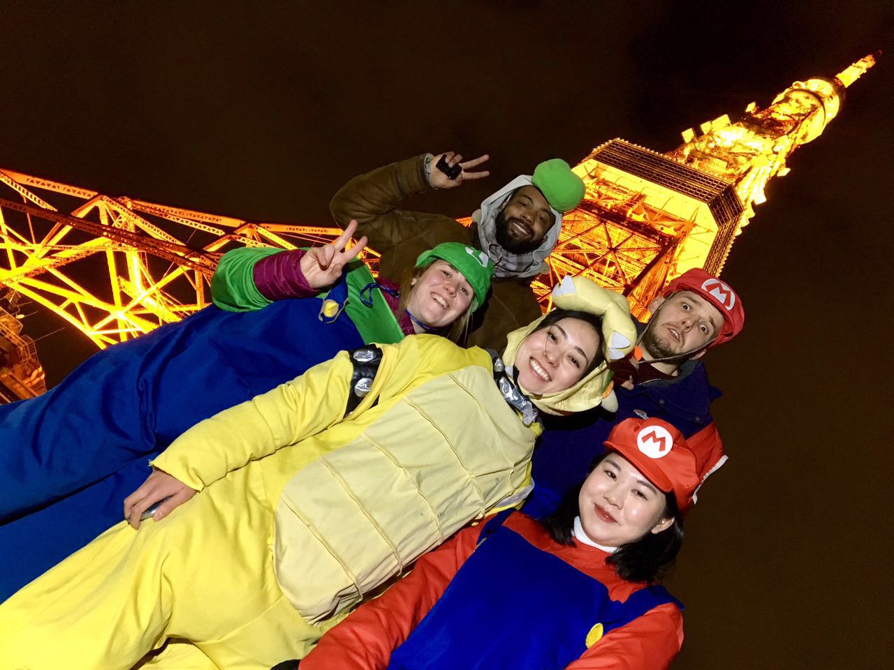 a group of people dressed up as Mario characters