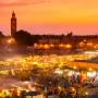 The sun begins to set over the twinkling lights of Djemaa el Fna | Marrakech | Morocco