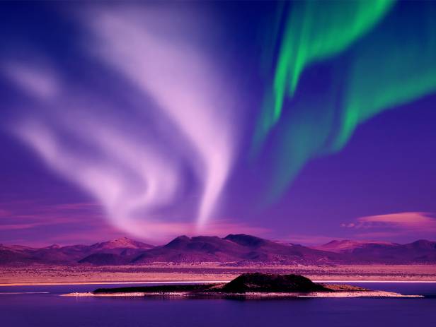 Colourful houses of Reykjavik against a backdrop of snowy mountains