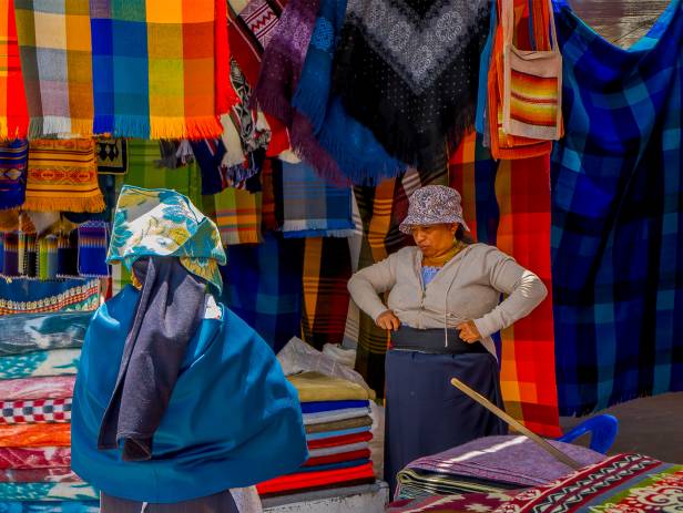 Brightly coloured textiles at a market in Otavalo