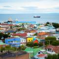 Scenic view of Punta Arenas - colourful houses and a boat in the background