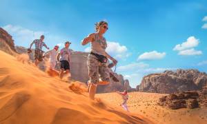 Running down dunes in Wadi Rum - Jordan tours - On the go Tours