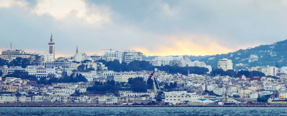 White washed buildings sitting along the waterfront in Tangier