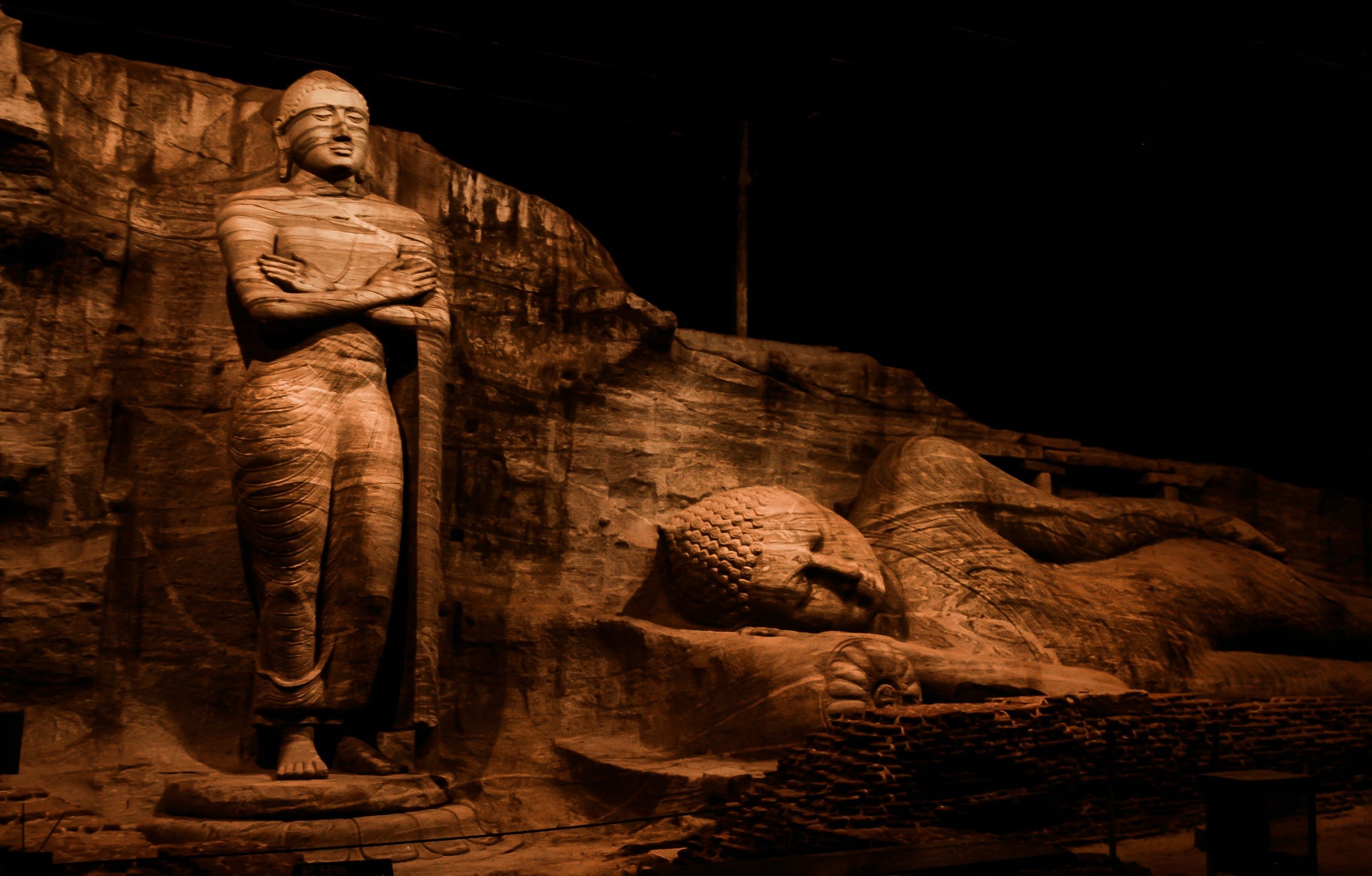 Two of the Buddhas at Gal Vinhara, one standing and one laying down