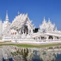 White Buddha statue in front of one of the many temples of Chiang Mai