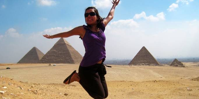 Woman jumping pyramid