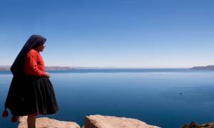 Woman overlooking Lake Titicaca - Peru - On The Go Tours