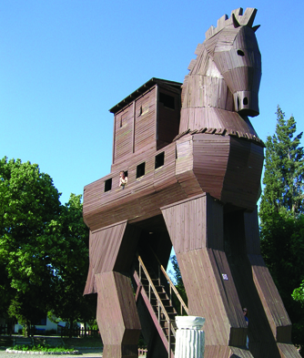 Someone poking out of the window of the replica trojan horse at Troy