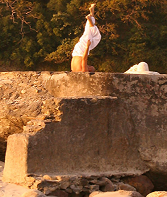 A man practicing yoga in the sun